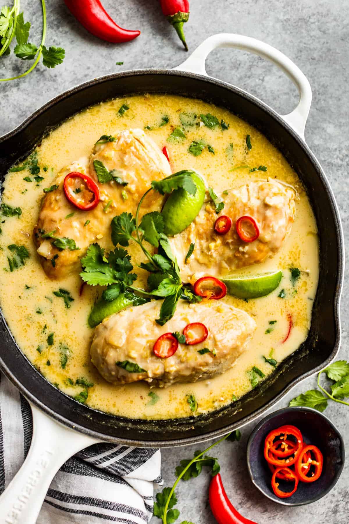 Coconut lime chicken in a cast iron skillet.