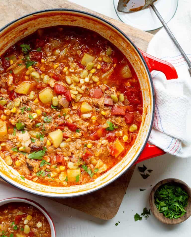 Brunswick stew served in a dutch oven pot.