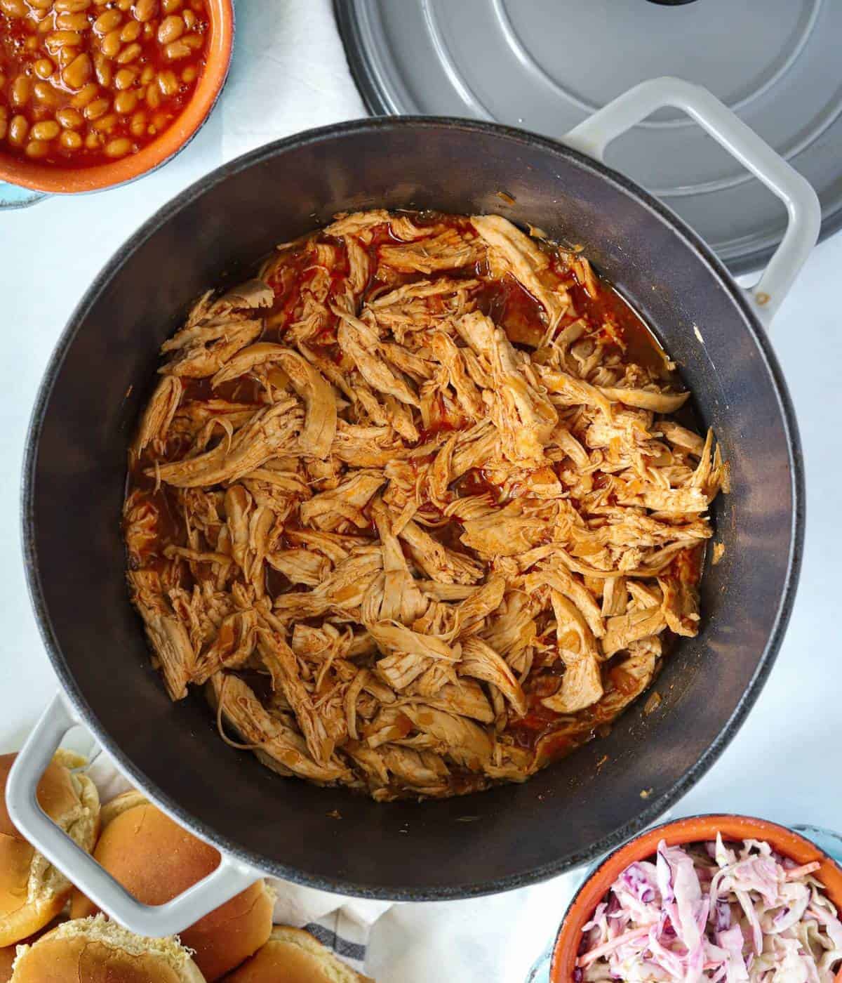 BBQ pulled chicken in a dutch oven pot.