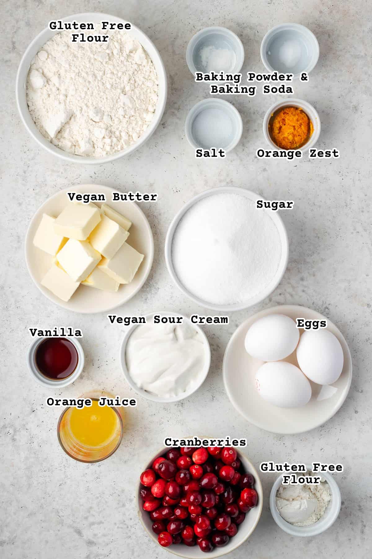 Ingredients for cranberry orange pound cake sitting on a counter.