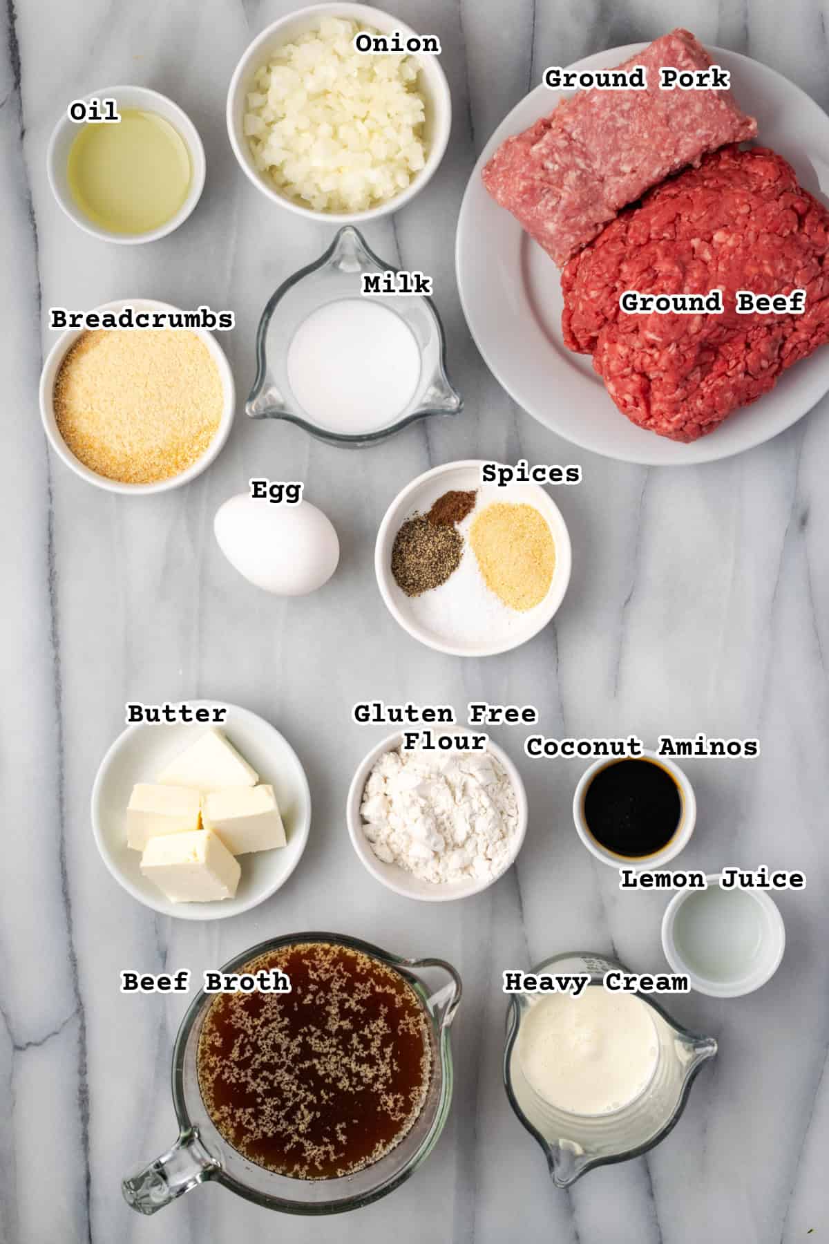 Ingredients for gluten free Swedish meatballs on a marble counter.