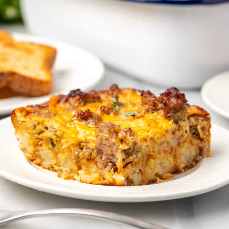 A slice of Mexican breakfast casserole served on a small plate.