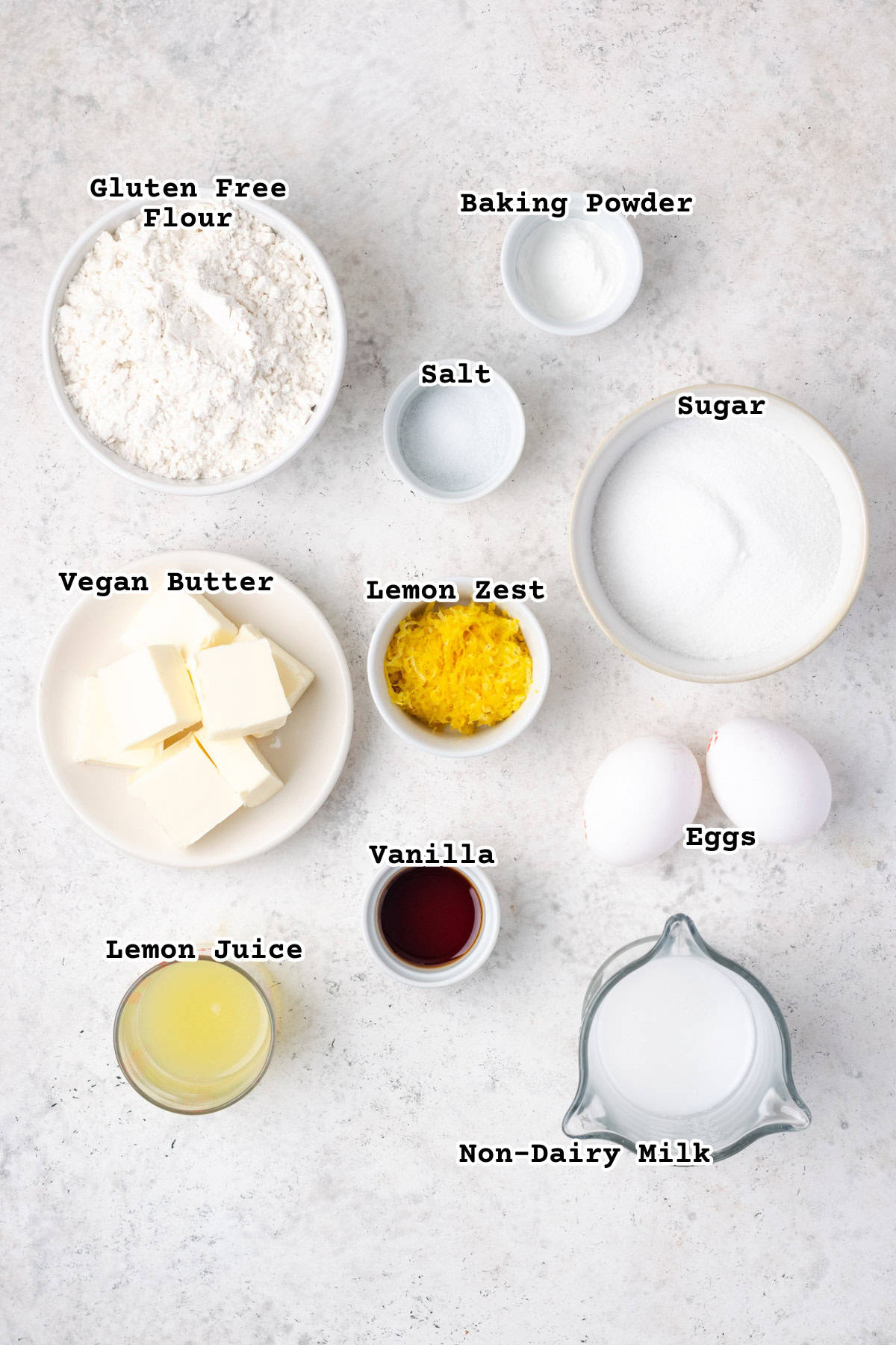 Ingredients for gluten free lemon cupcakes sitting on a counter.