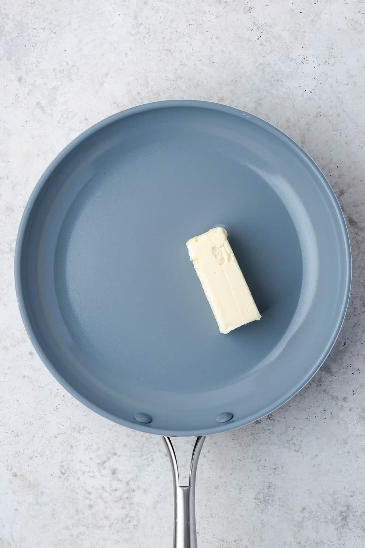 A measure of butter in a large skillet.