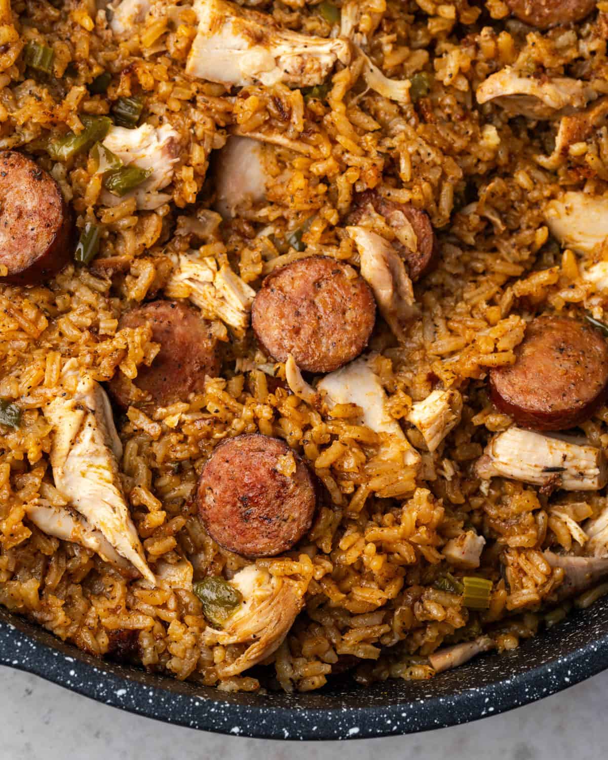 Chicken and sausage jambalaya in a large pot. 