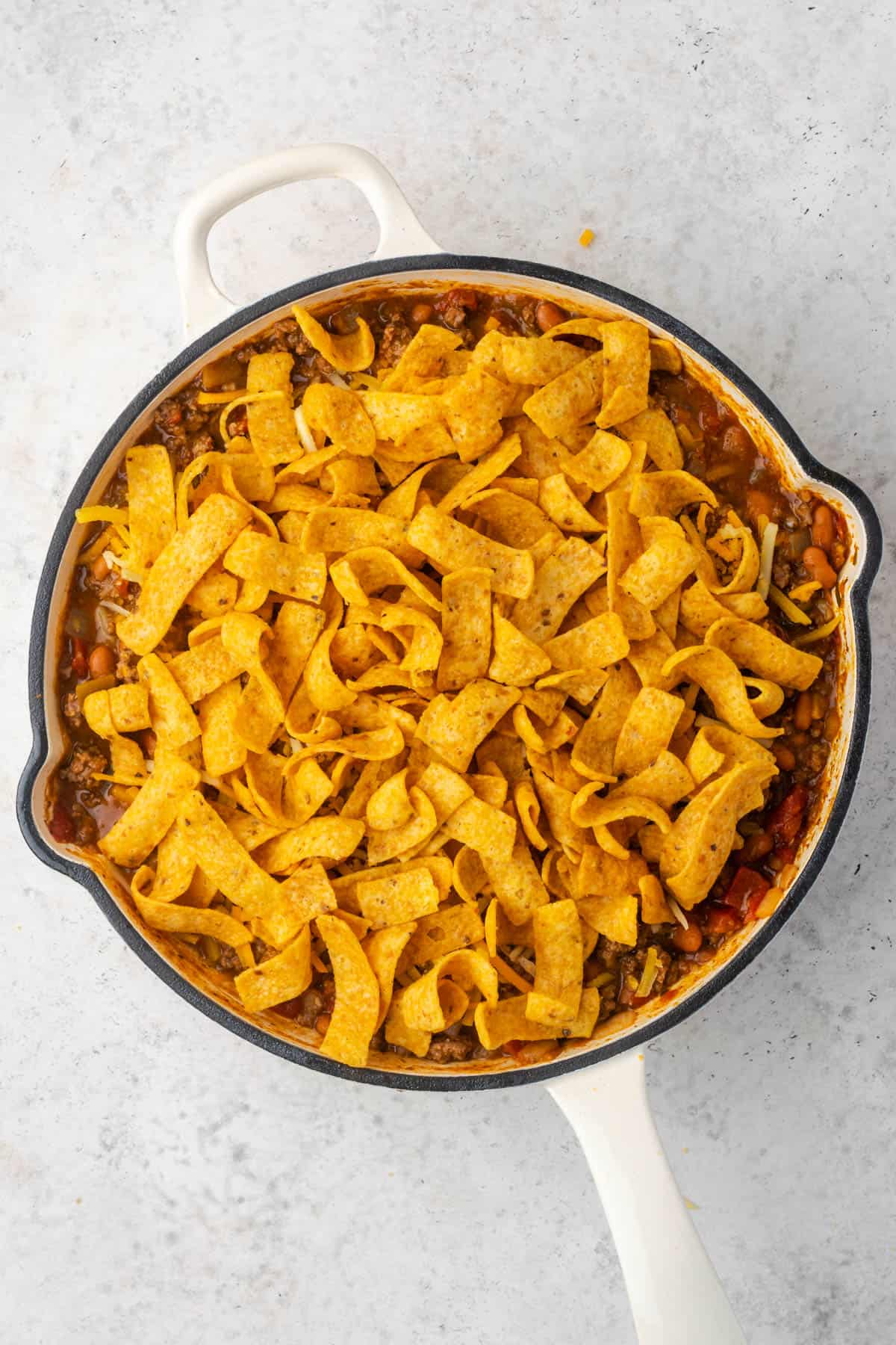 Frito corn chips on top of the casserole.