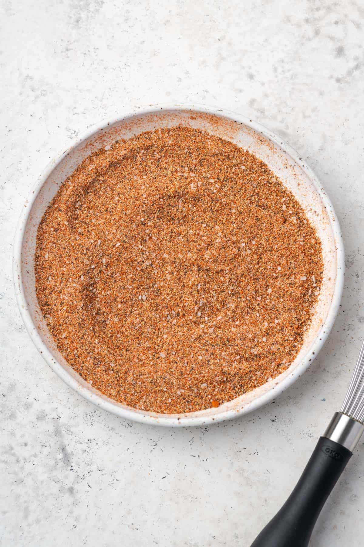 A batch of gluten free Cajun seasoning mixed in a small white plate.