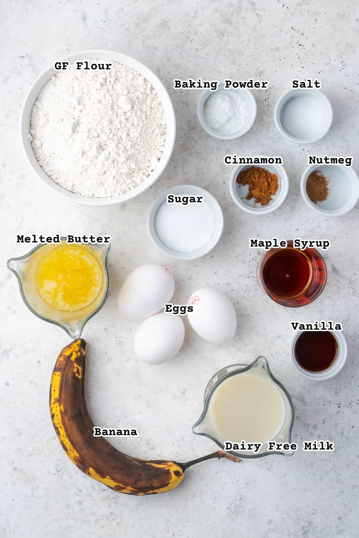 Ingredients for gluten free banana waffles sitting on a counter.