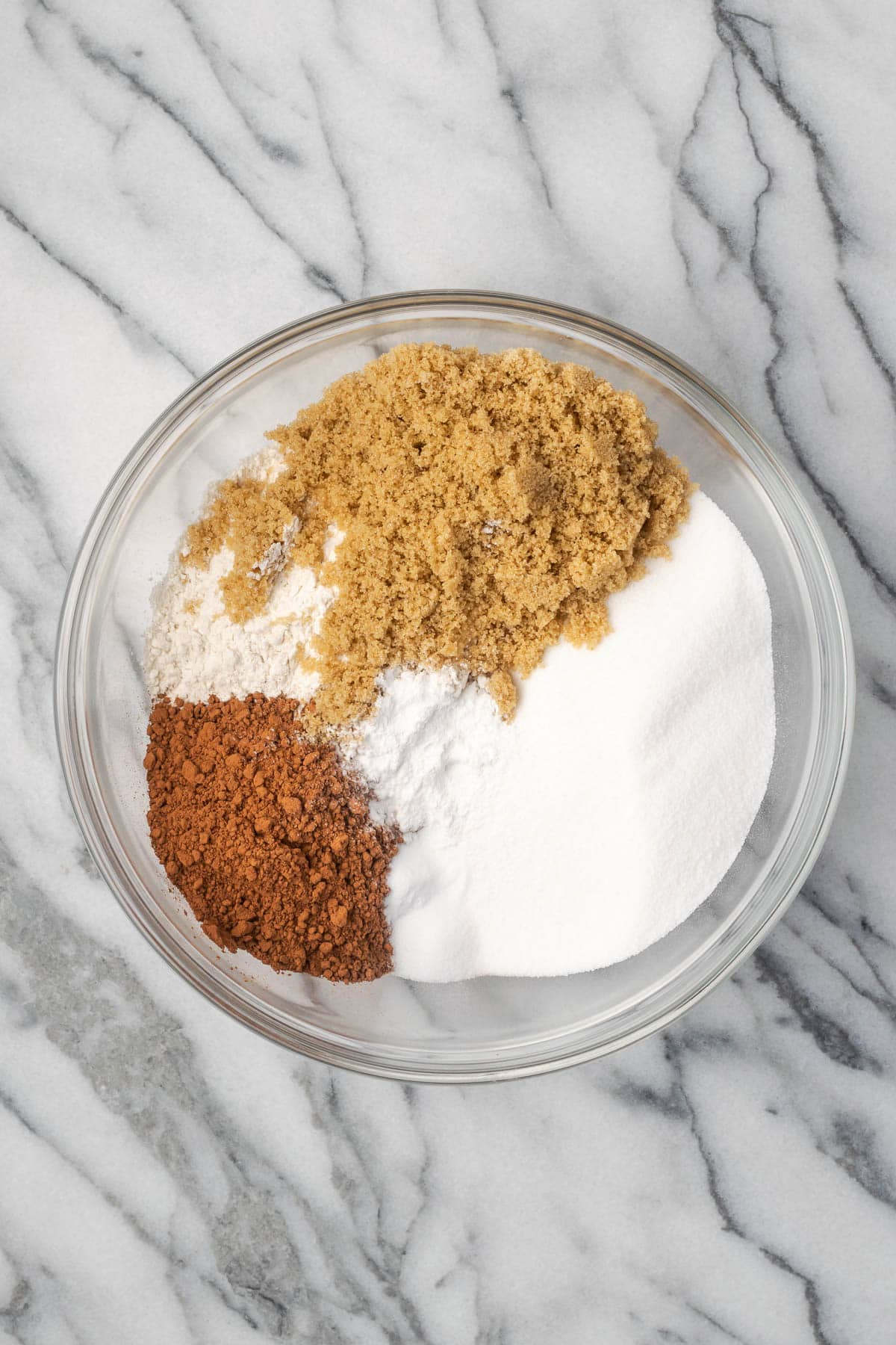 Dry ingredients in a large glass mixing bowl. 