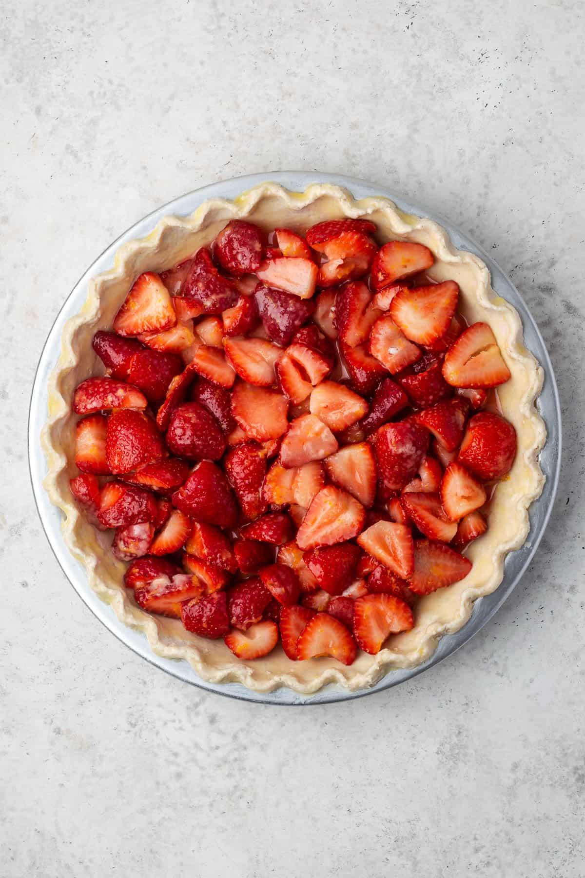 Strawberry pie filling poured into a frozen pie shell. 