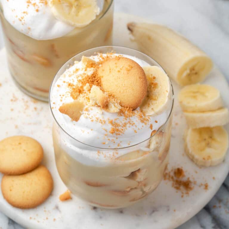 A serving of gluten free banana pudding presented in a glass.