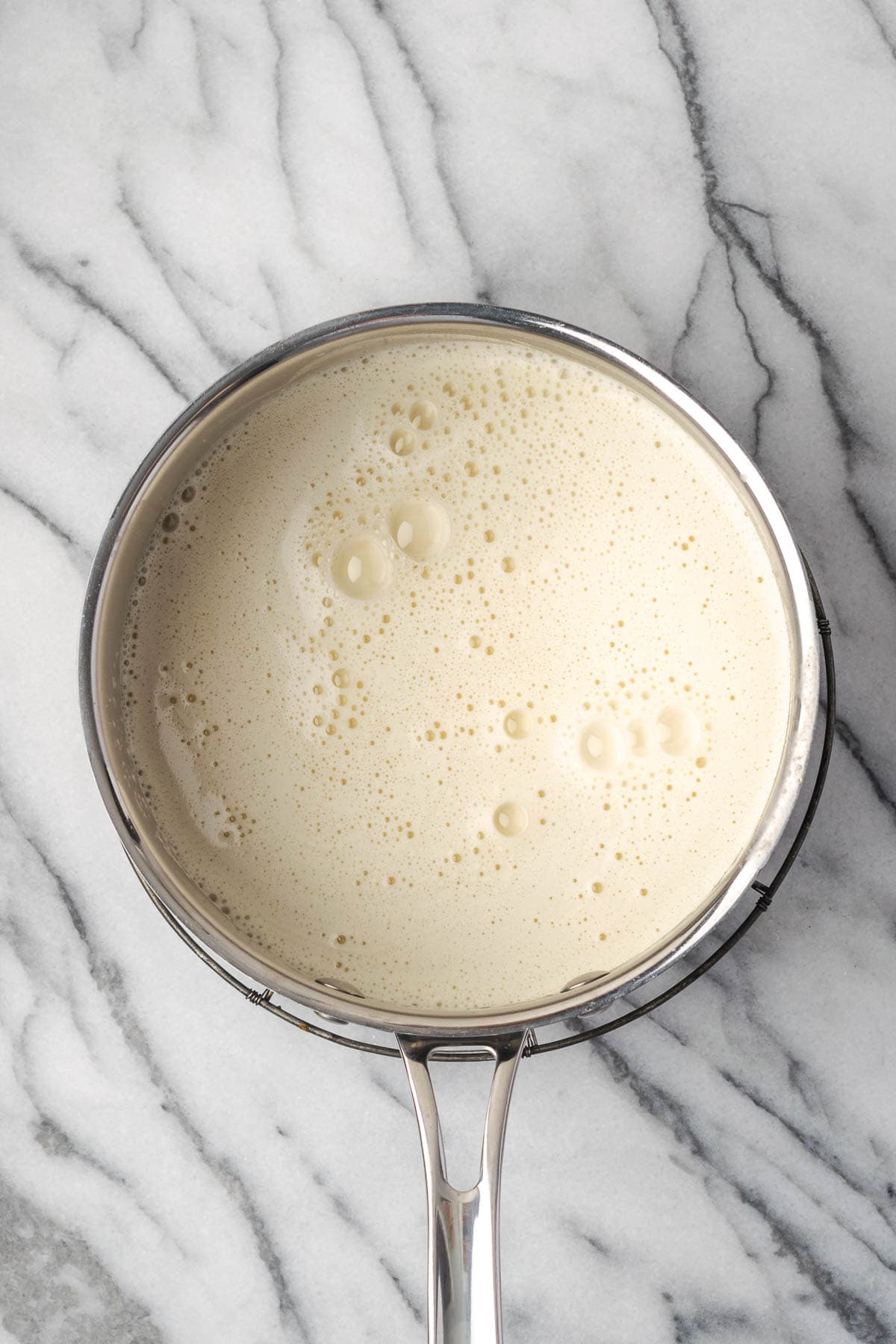 Pudding mixture in a saucepan. 