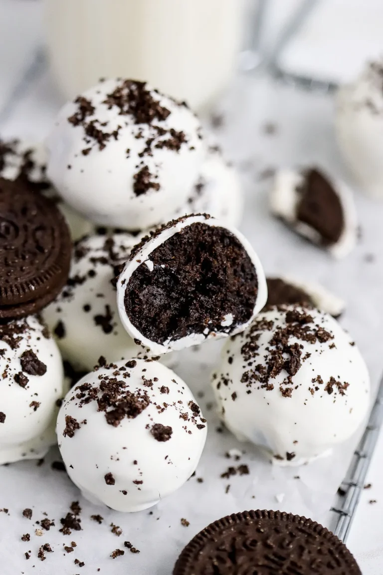Several gluten free oreo cake balls in a pile. 