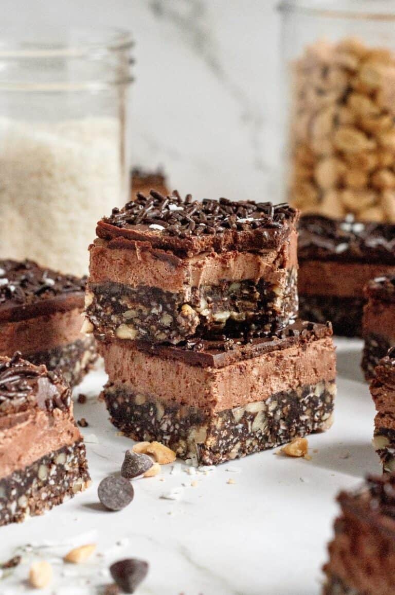 Two no bake chocolate bars stacked on top of each other on a marble counter.