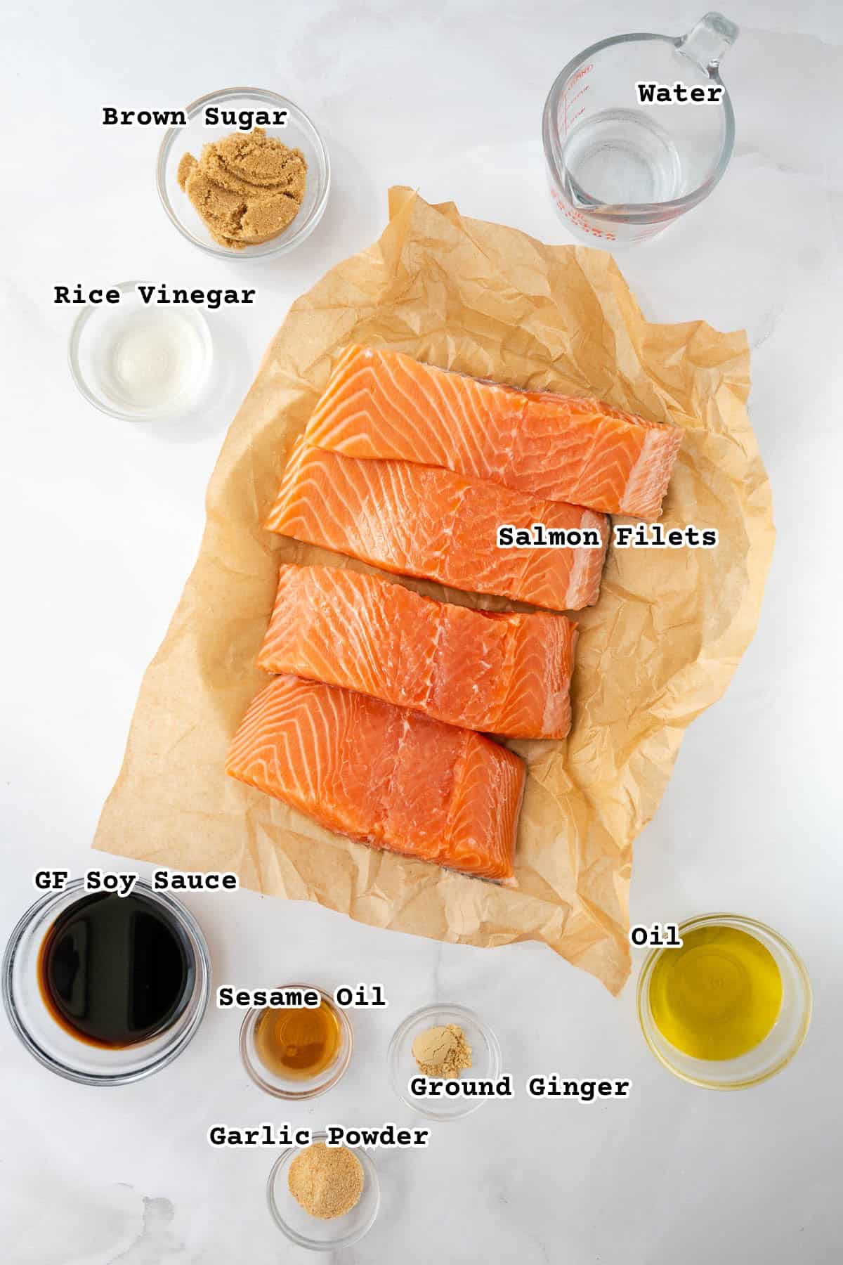 Ingredients for baked teriyaki salmon on a white counter.
