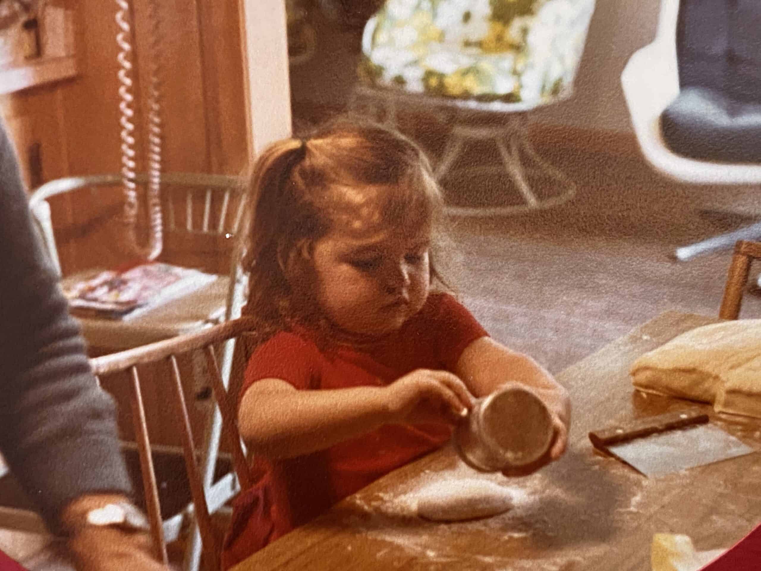 Tiffany as a small child making butter rolls.