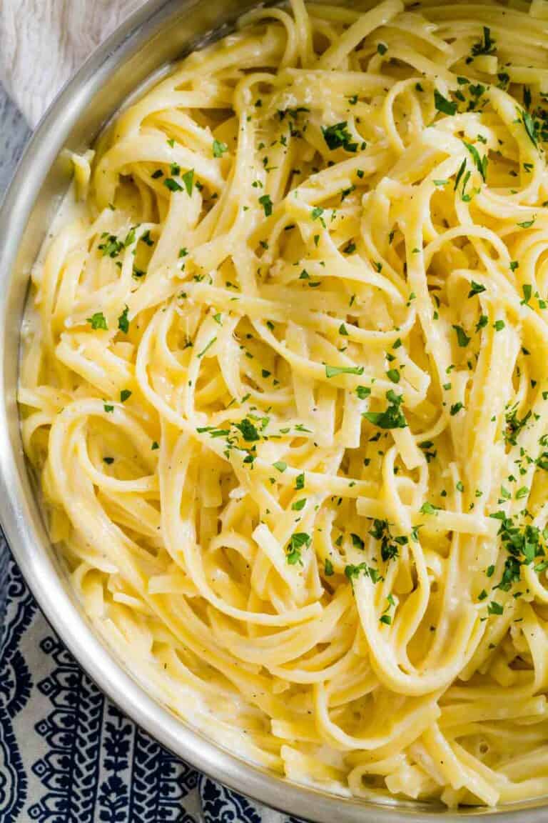 Gluten free fettuccine alfredo in a metal pan. 