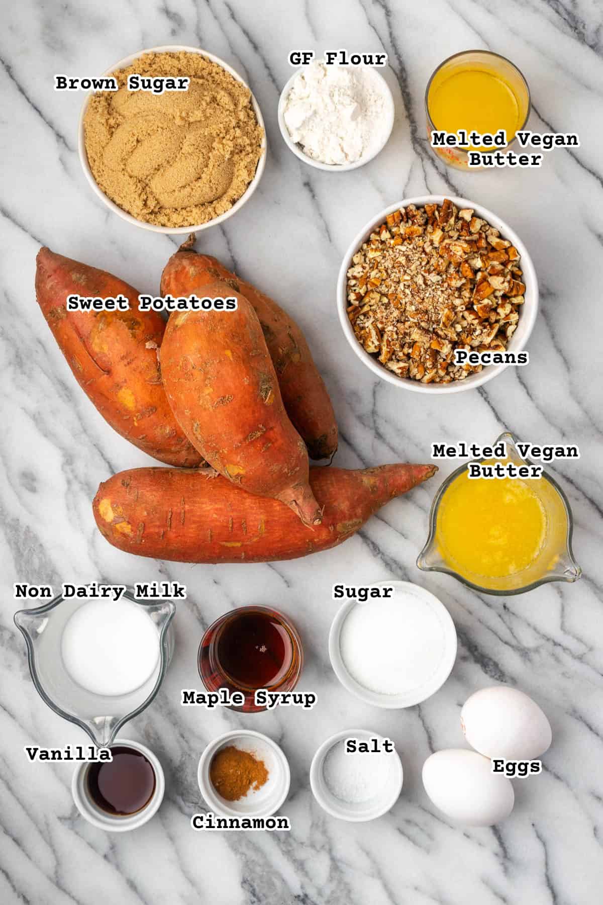 Ingredients for sweet potato casserole on a marble counter.