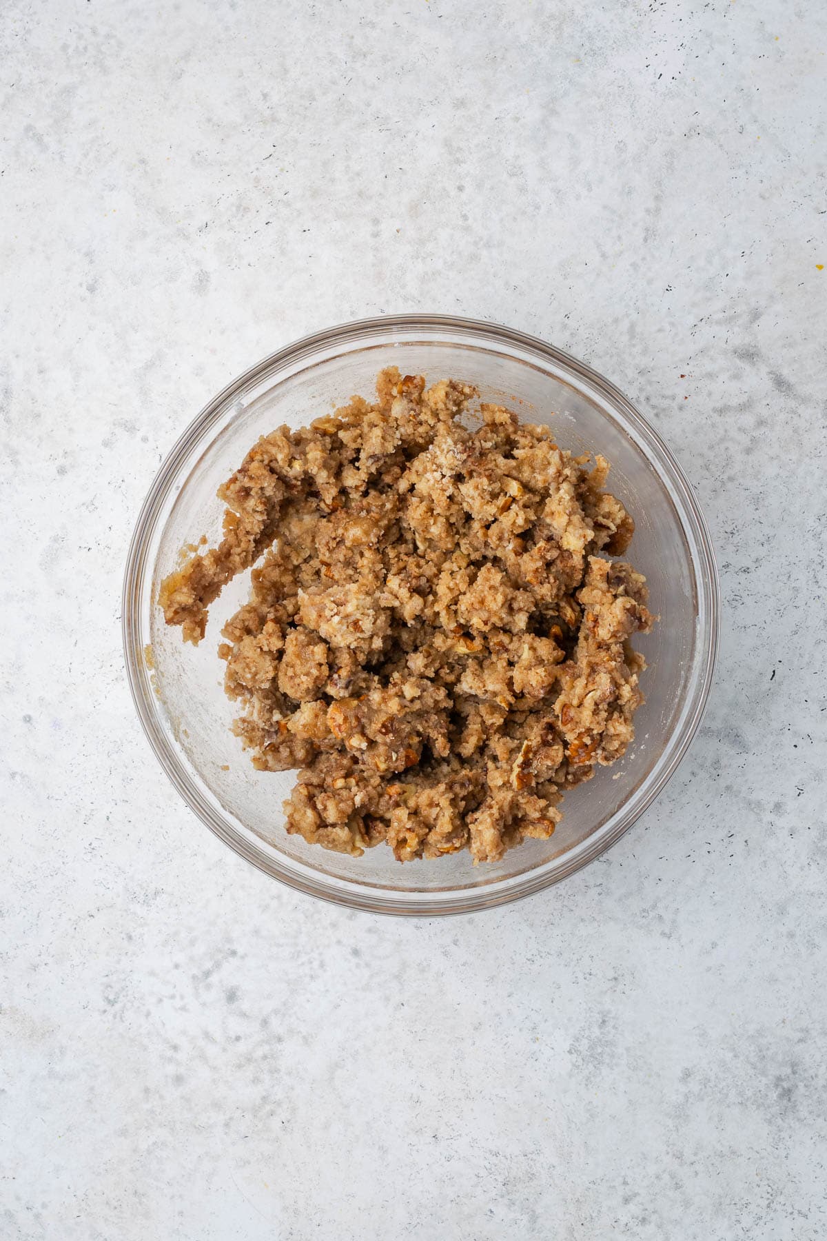 Flour, brown sugar, pecans, cinnamon, salt and melted butter combined in a medium bowl to create the crumble topping.