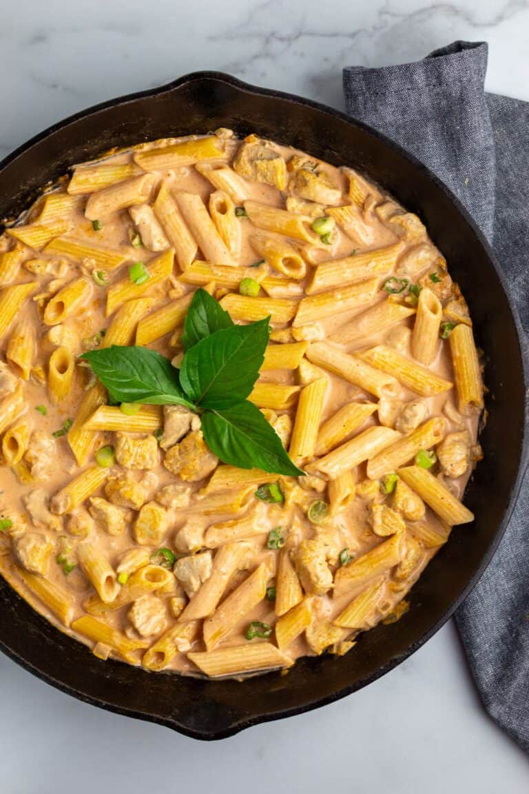 Pieces of chicken and gluten free penne pasta in a creamy curry sauce. 
