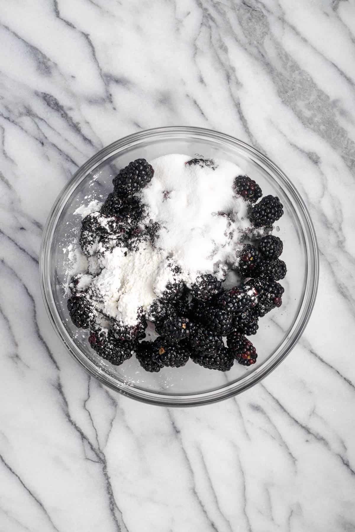 Blackberries, sugar, corn starch and lemon juice combined in a large mixing bowl. 