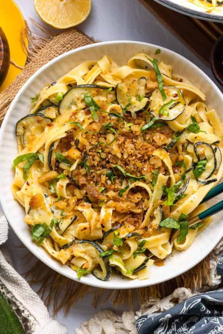 A serving bowl of lemon and zucchini pasta. 