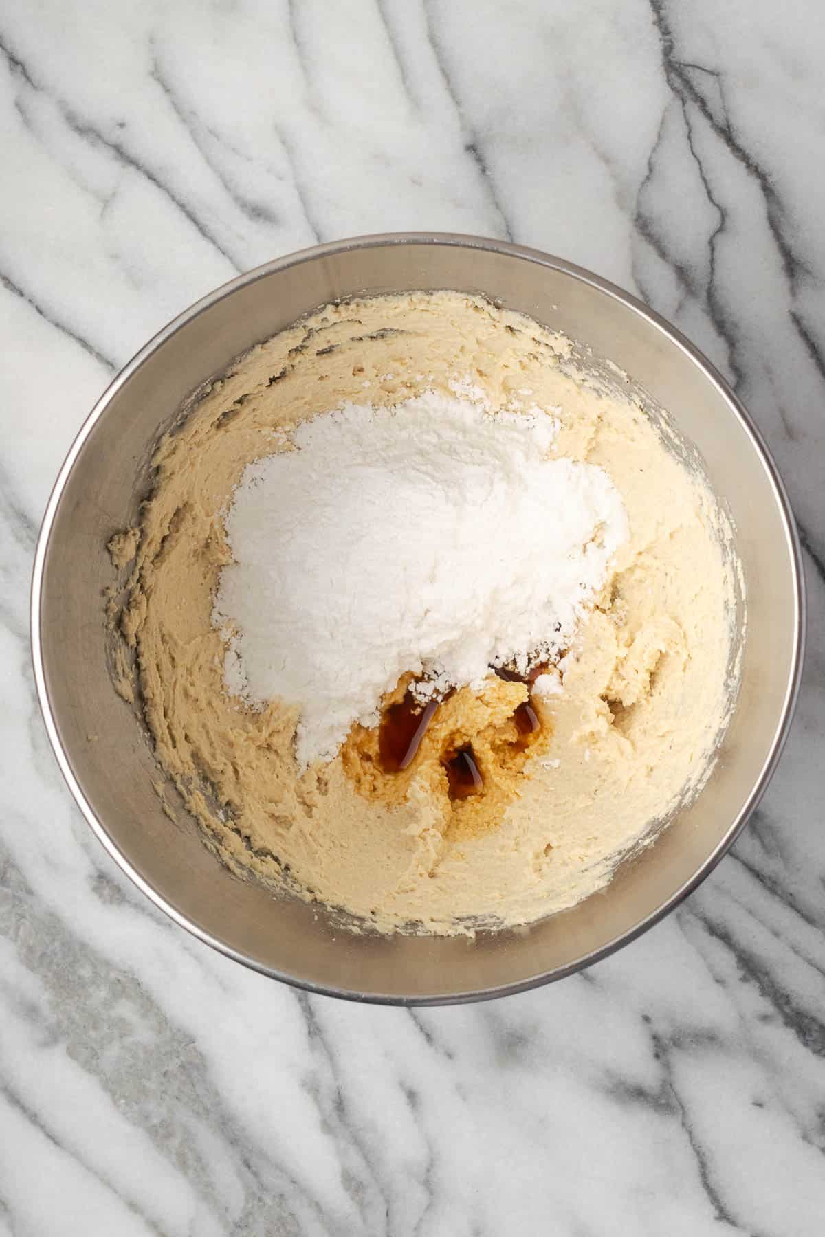 Powdered sugar, vanilla and salt added to the cream cheese.