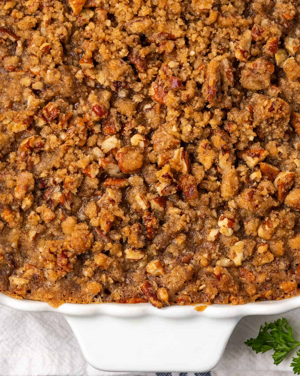 A freshly baked sweet potato casserole sitting on a table.