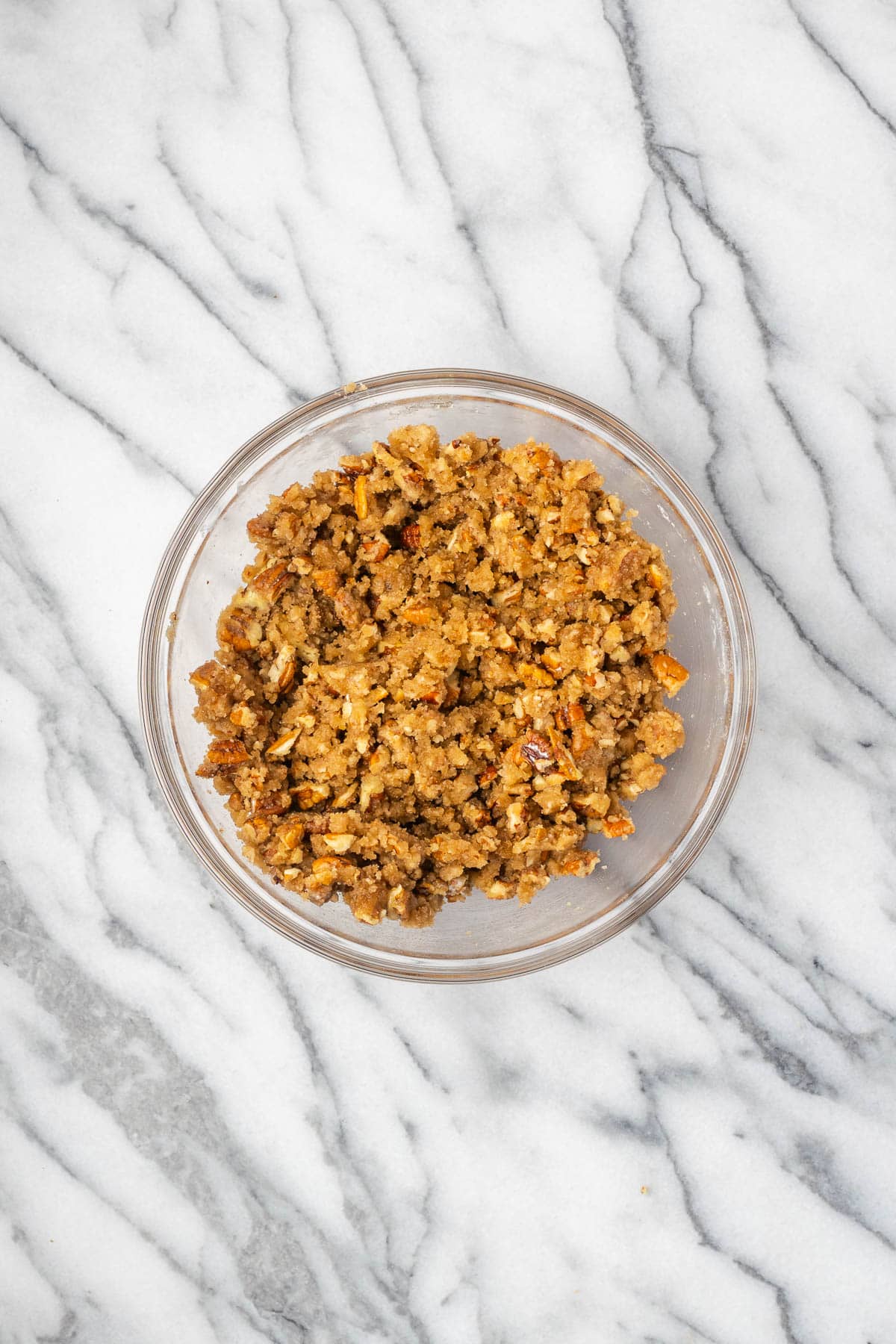 Pecan topping combined together in a small mixing bowl.