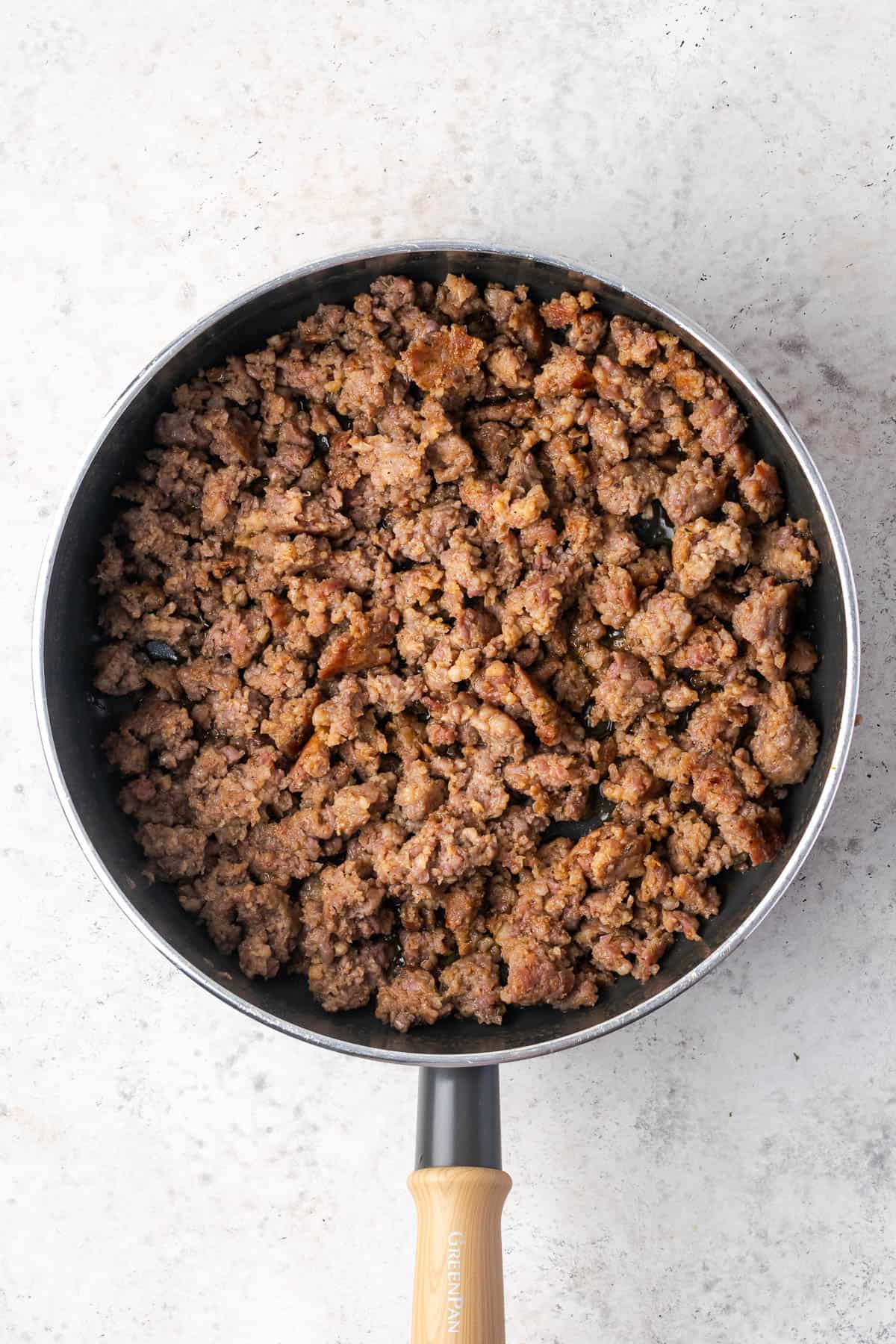 Cooked sausage in a skillet. 