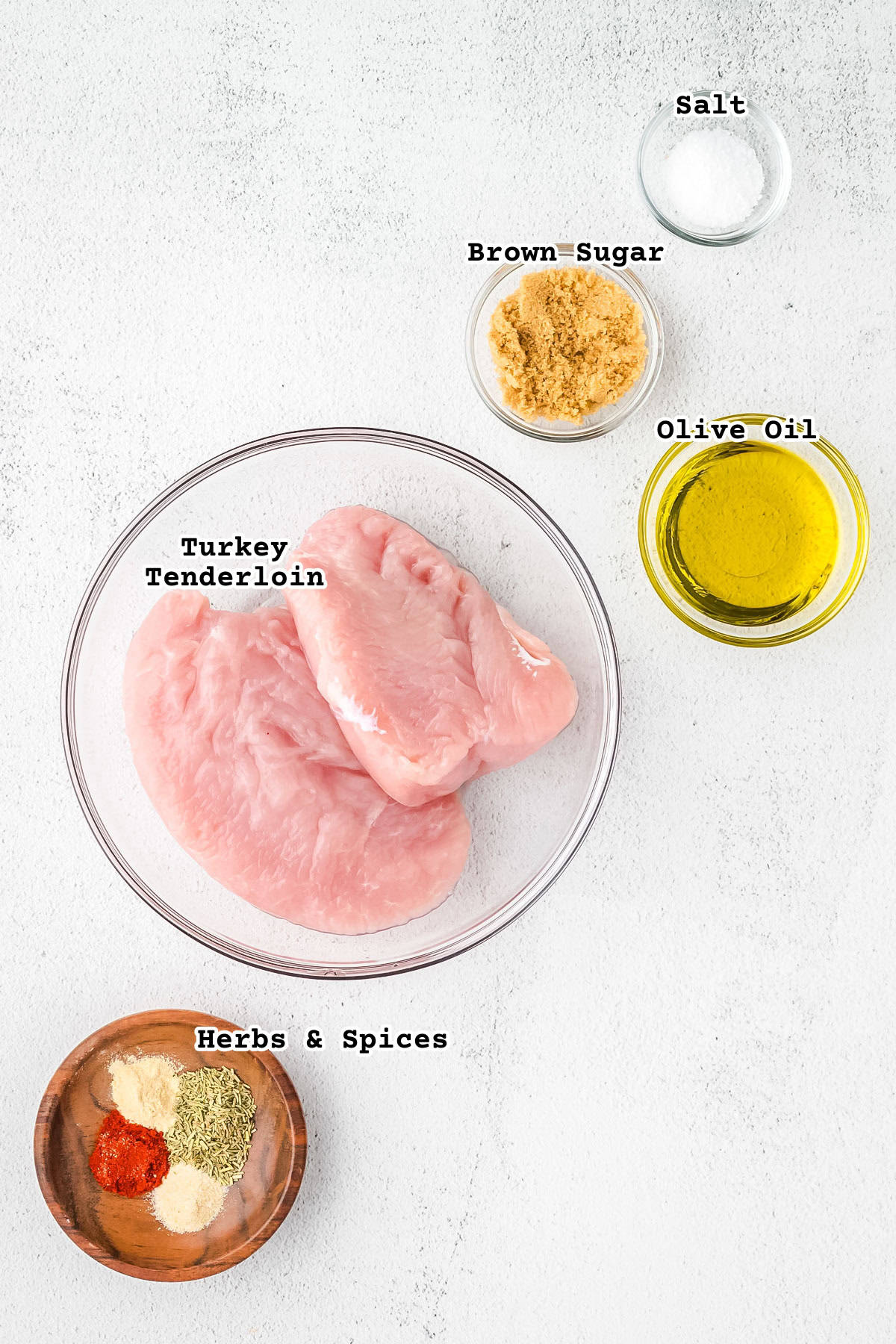 Ingredients for an air fryer turkey tenderloin sitting on a white counter.