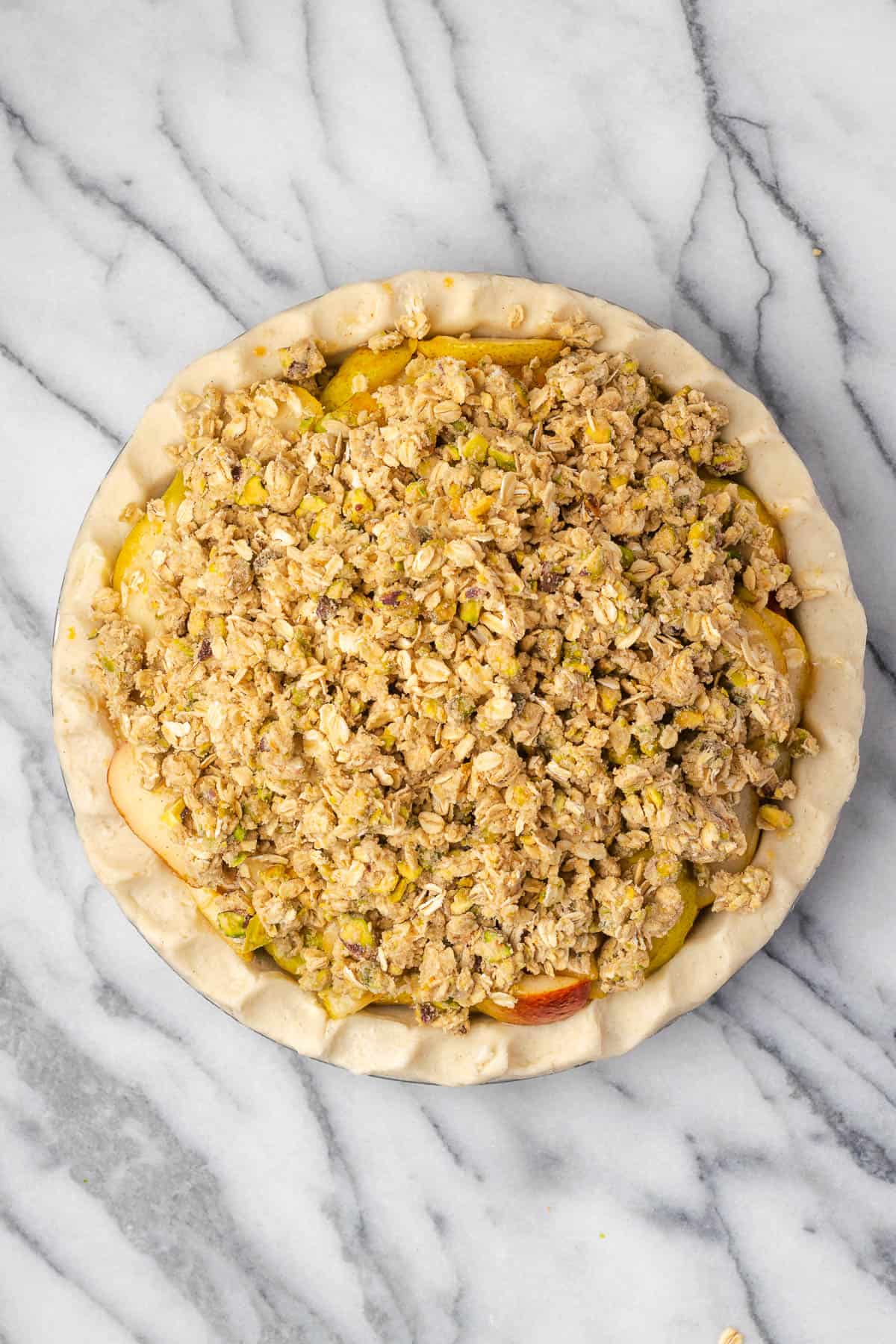 Crumble topping added to the top of the pear pie.