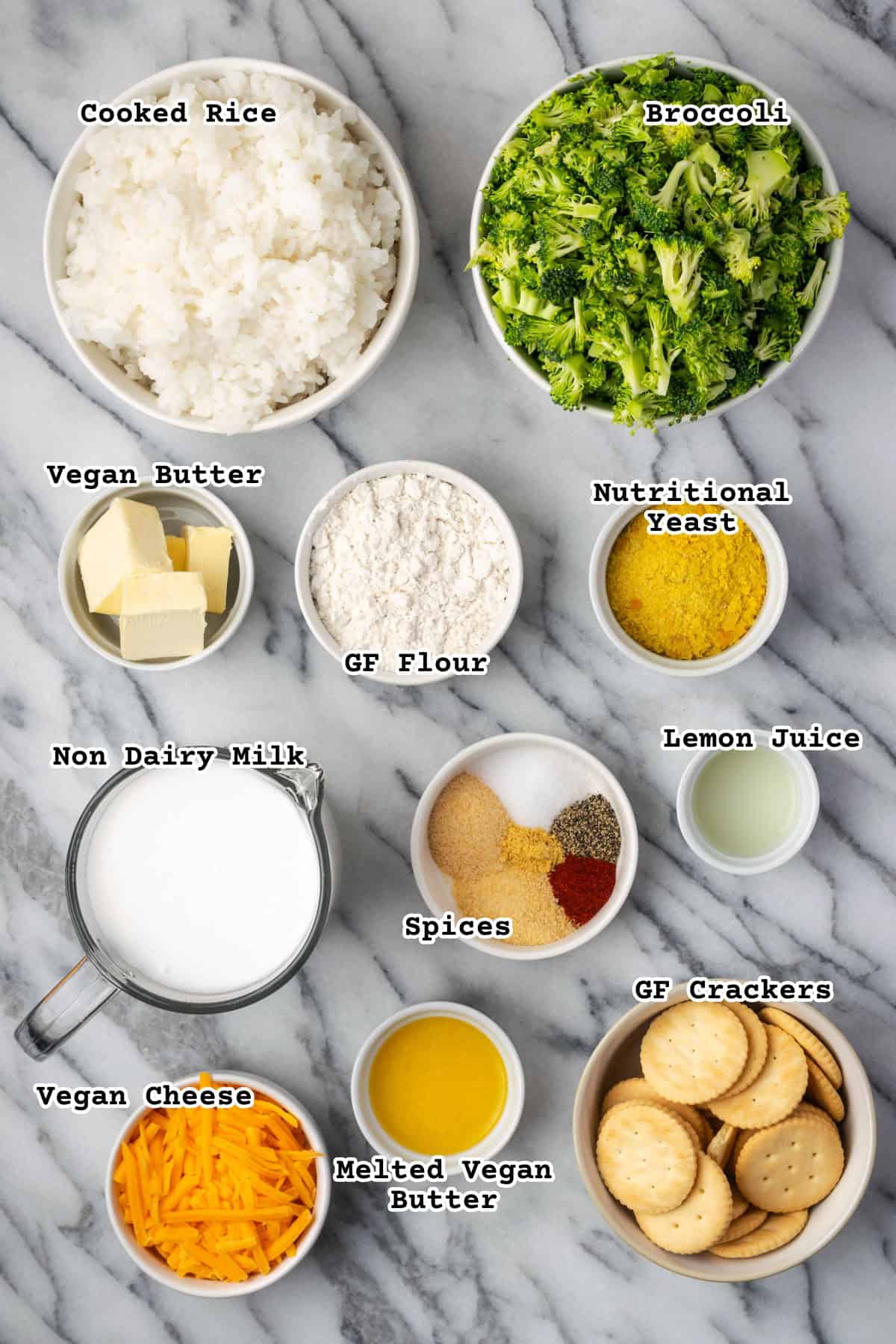 Ingredients for a broccoli rice casserole sitting on a marble counter. 