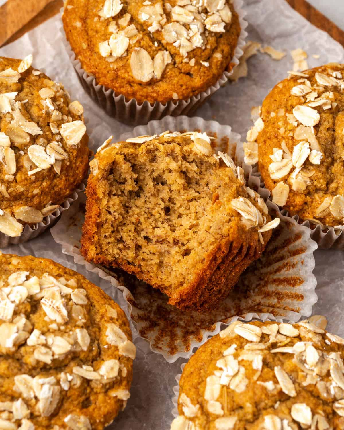An oat flour banana muffin with a bite taken out.