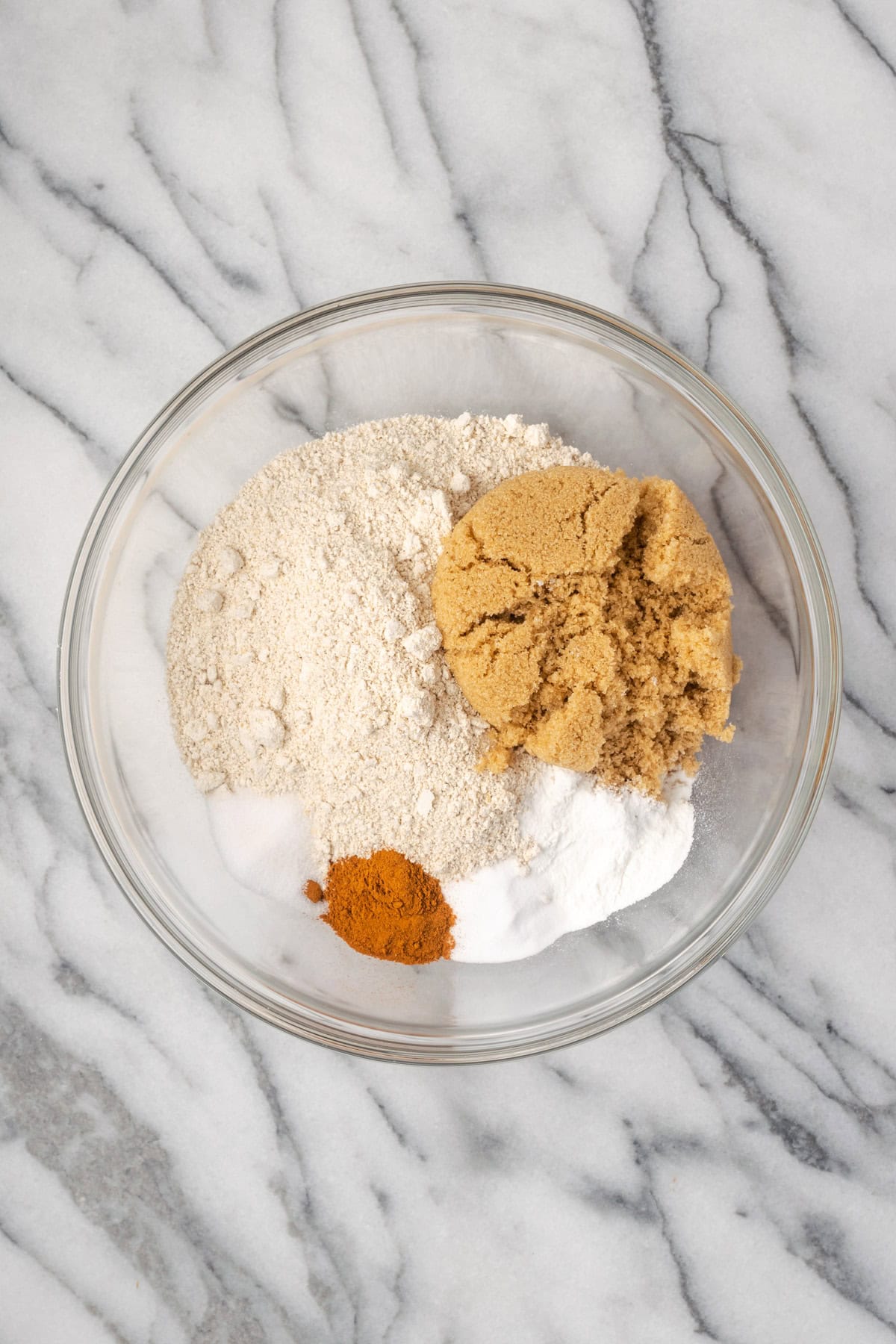 Oat flour, brown sugar, baking powder, baking soda, cinnamon and salt in a large mixing bowl.