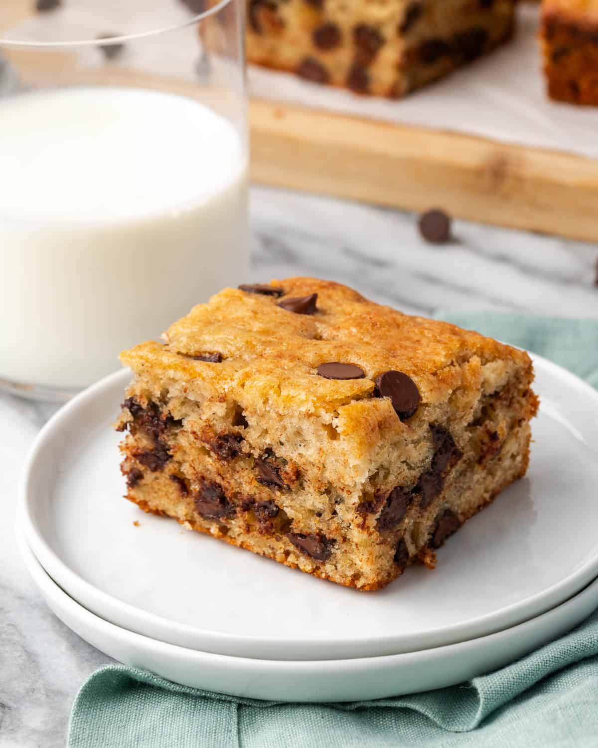 A slice of banana chocolate chip cake served on a small dessert plate.