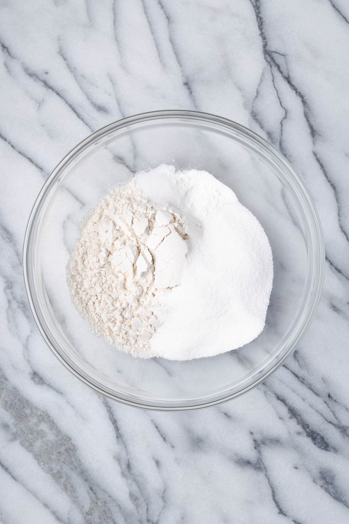 Gluten free flour, sugar, baking powder and salt combined in a large mixing bowl.