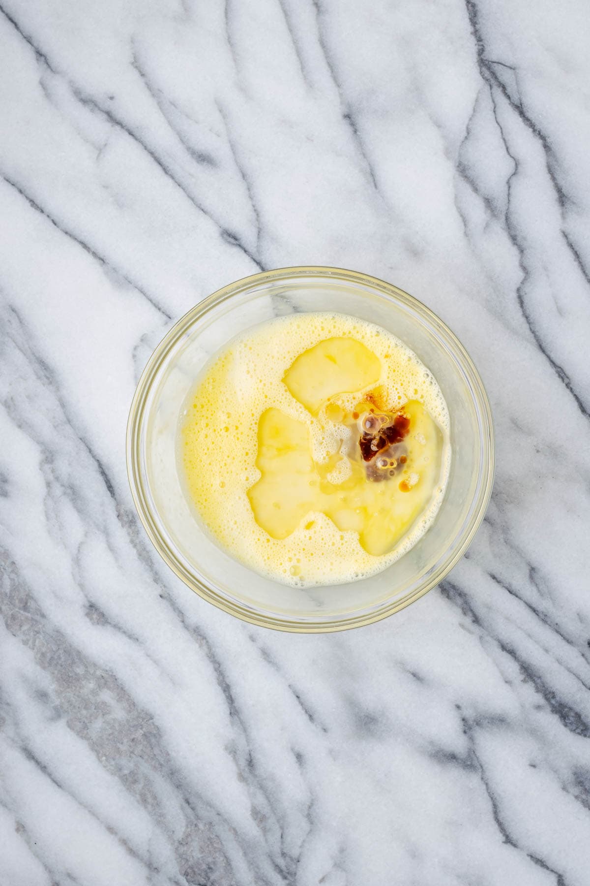 Oil, milk and vanilla added to the beaten egg.