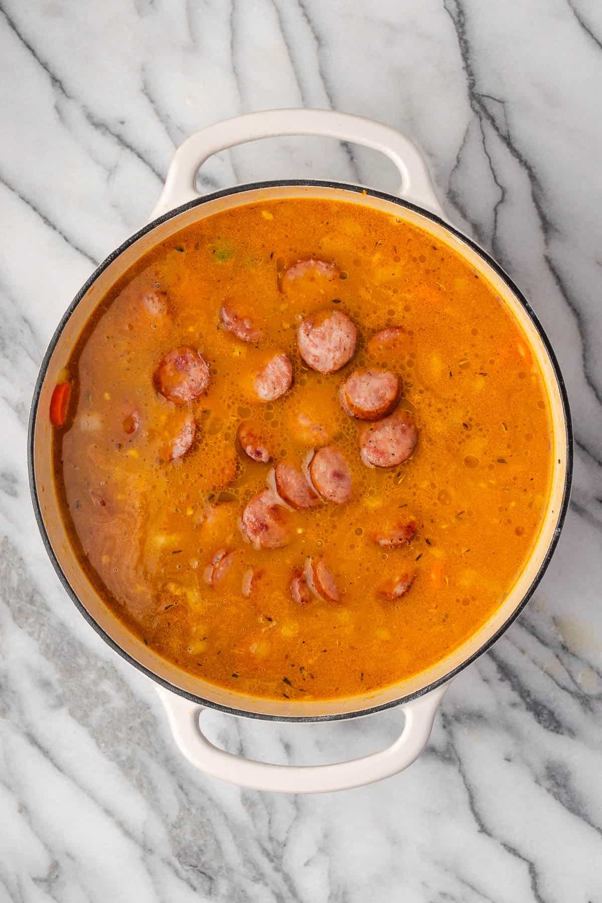 Cooked sausage returned to the soup pot. 