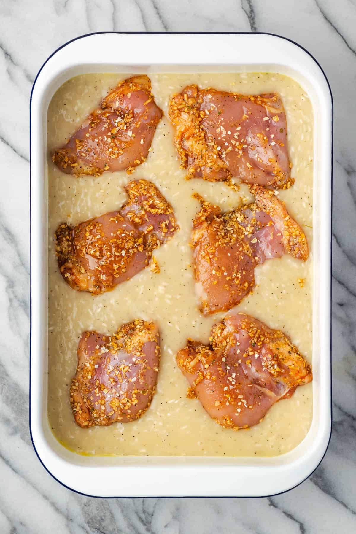 Chicken thighs nestled into the rice and cream sauce. 
