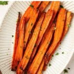 Pin for oven roasted carrots with maple syrup.