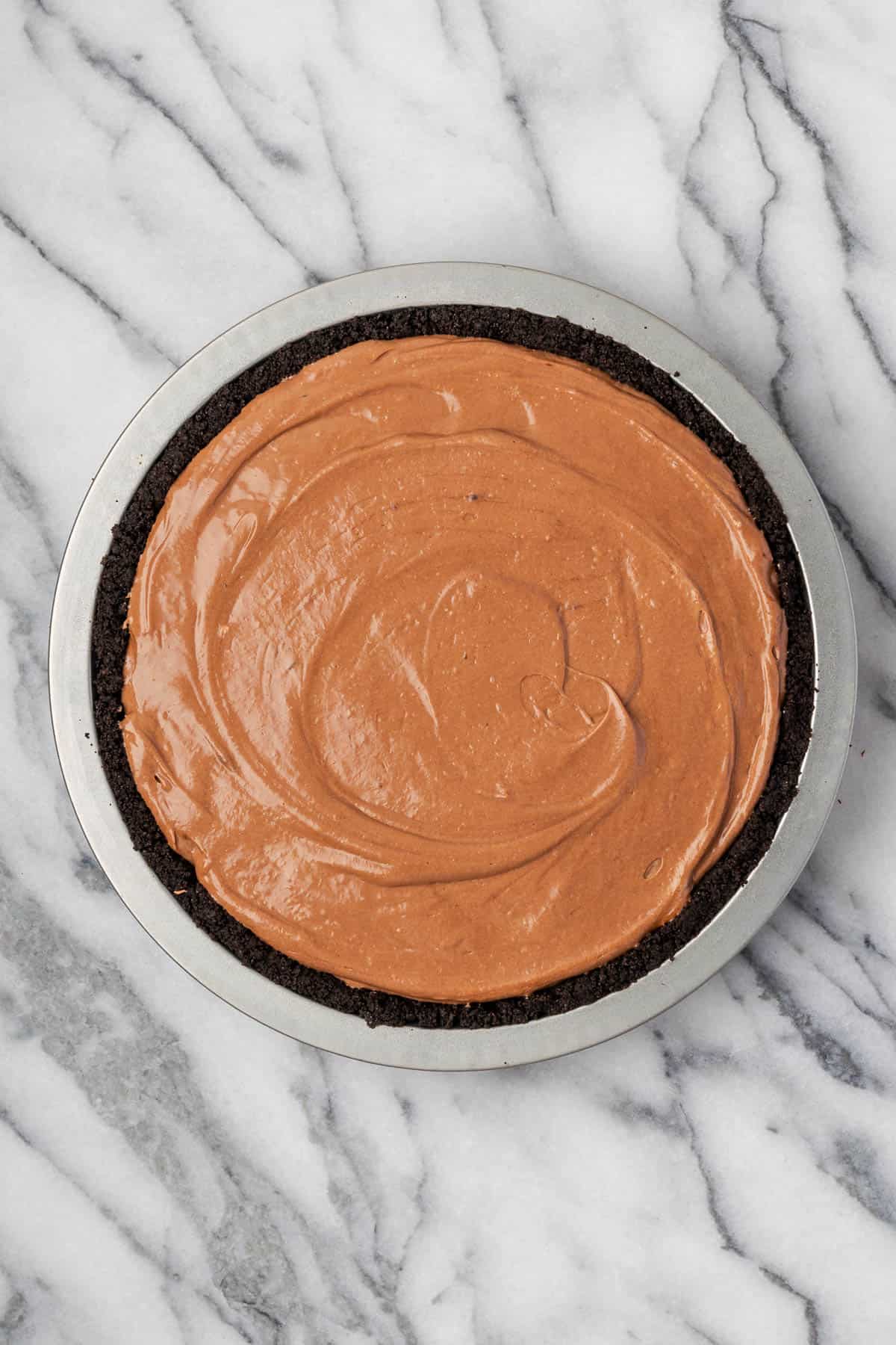 Creamy Nutella pie filling spread into a chocolate cookie crust.