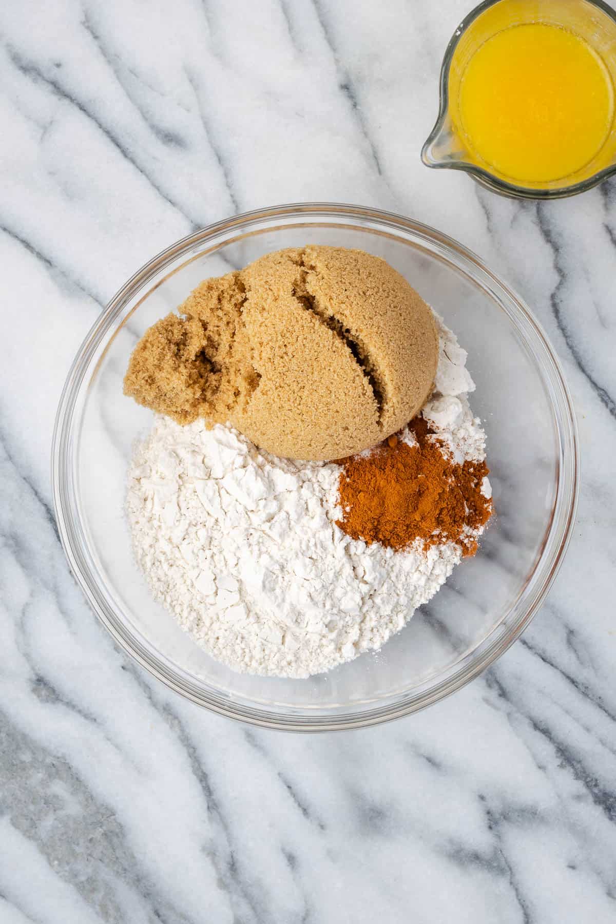 Gluten free flour, brown sugar, cinnamon and salt combined in a mixing bowl.